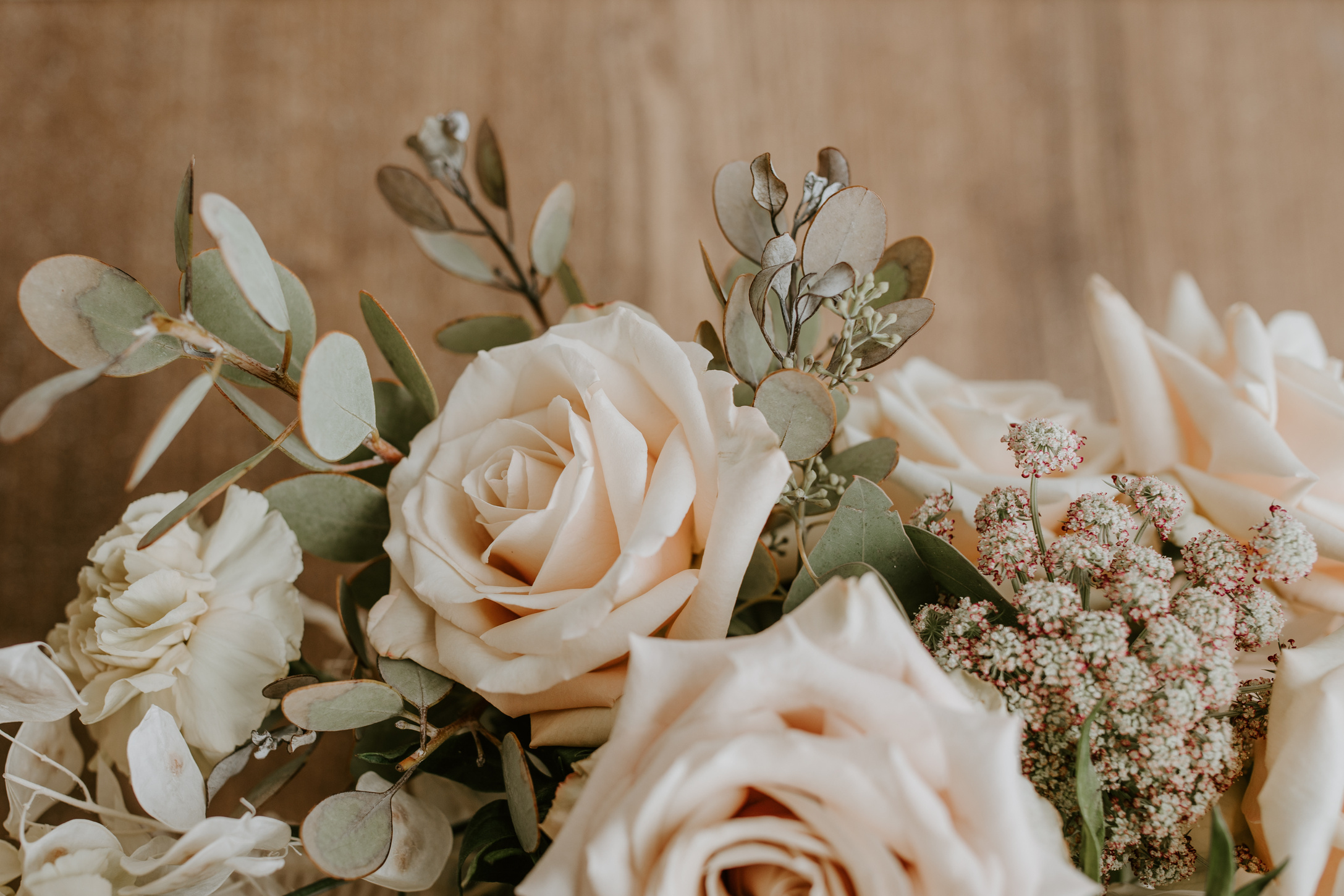 Bunch of white roses with decorative branches